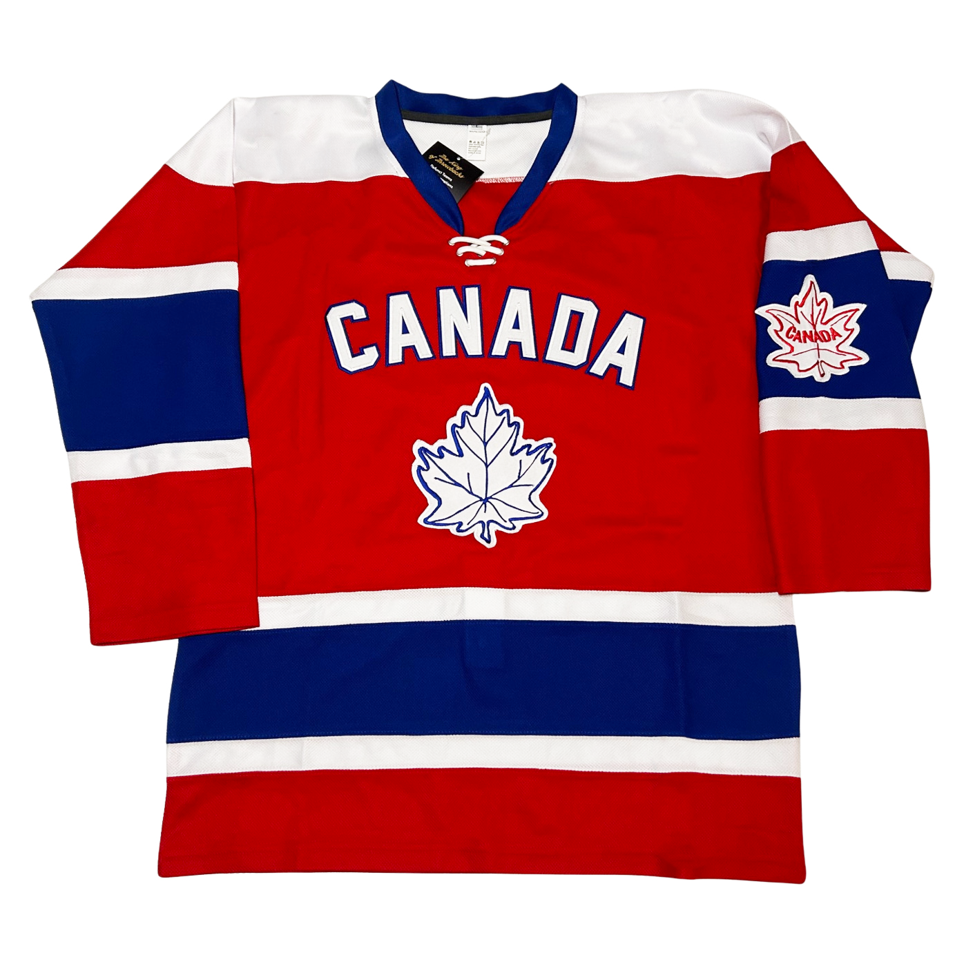 1964 Canada Hockey jersey. Red. Blue collar, white shoulders. Small red, large blue, small white bands mid-sleeve and just above waist. Canada in white with blue trim arched across chest. White maple leaf with blue detail large on chest. Small white maple leaf with red detail and "Canada" in middle. Royal Retros