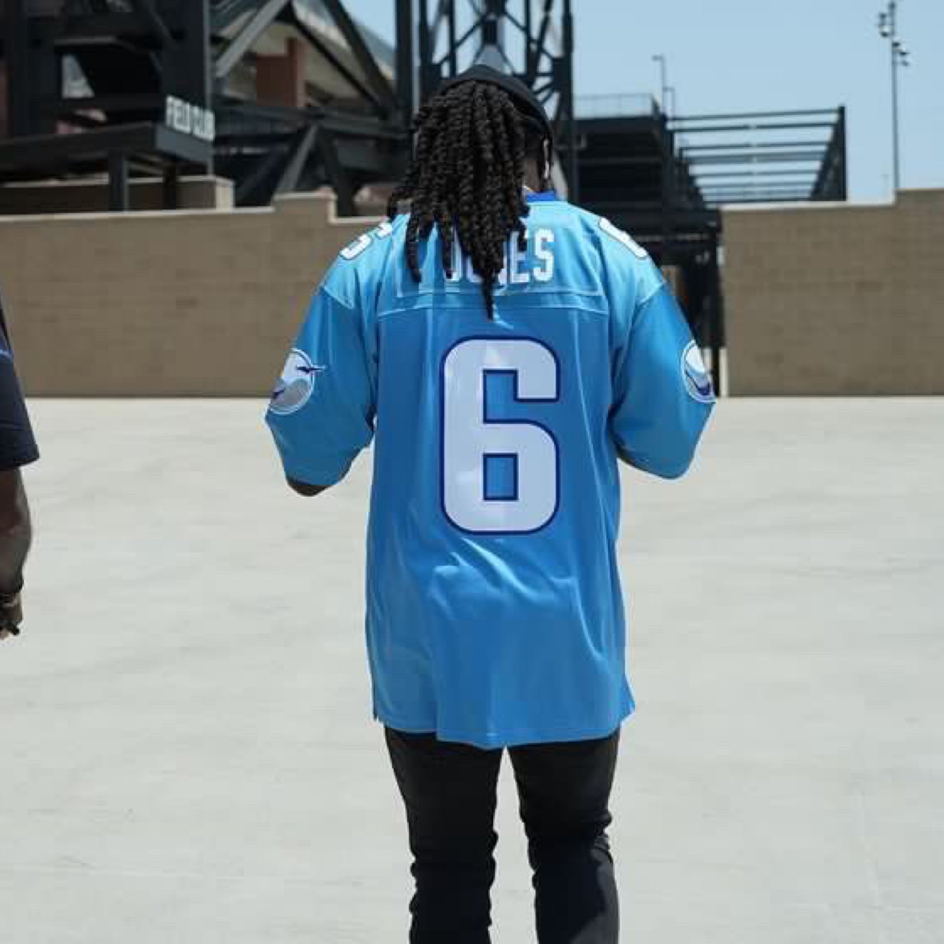 Boston Breakers jersey light blue worn by man in a stadium parking lot. Royal Retros