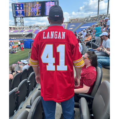 Fan wearing Ryan Langan jersey red back Legion Protective Field Royal Retros