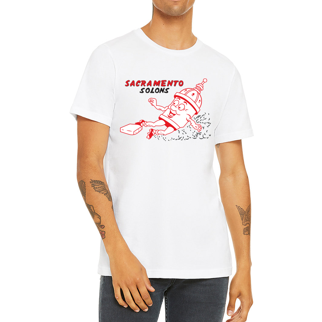 Sacramento Solons T-shirt. White. Sacramento in Red, Solons in black below on right chest. Image of cartoon capital building, white with red detail,  sliding into a base, right to left. Royal Retros