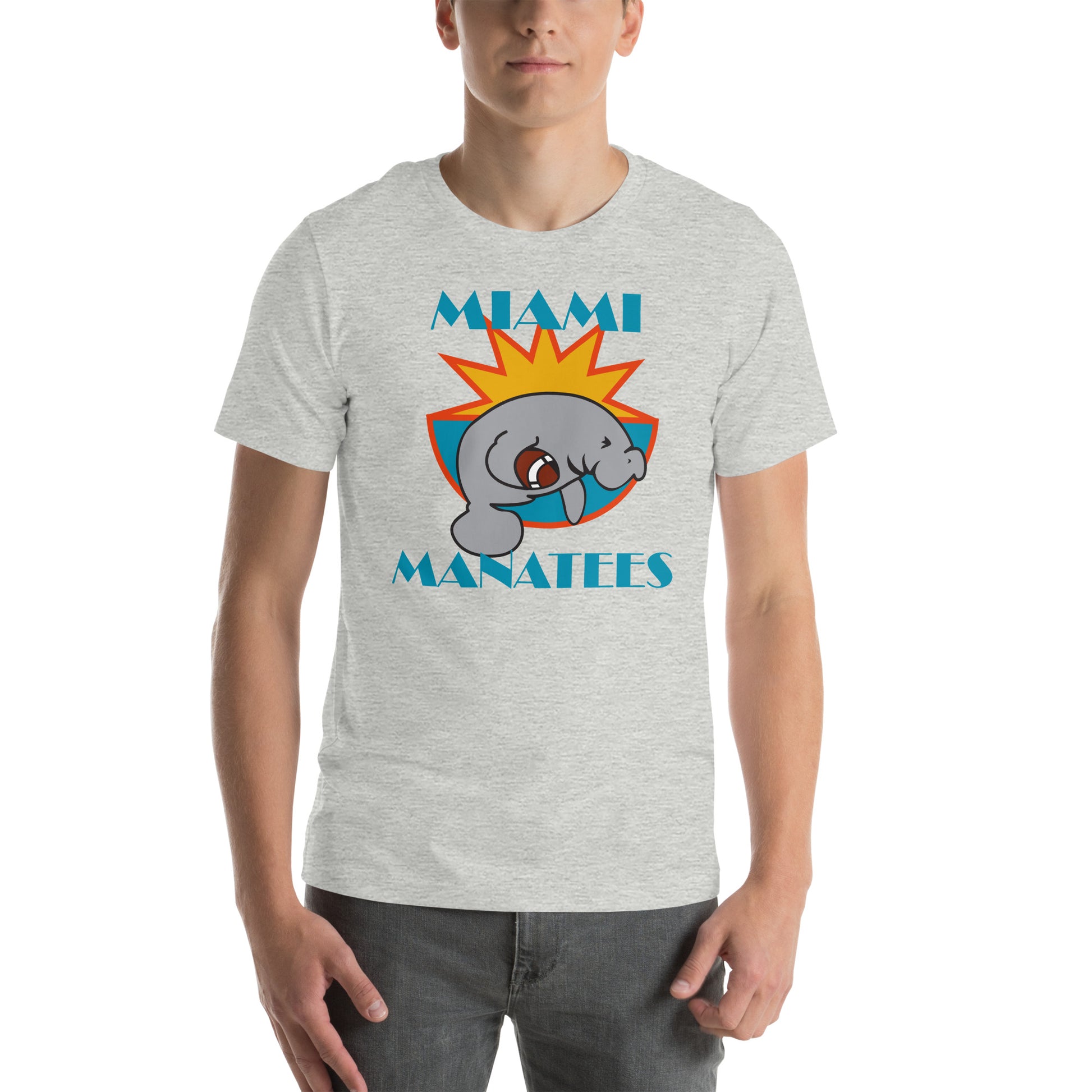 Miami Manatees T-Shirt heather grey. Manatee holding football leaping on front of half sun with orange trim and aqua bowl. Miami in Broadway Script aqua above Manatees in Brush Script aqua below. Royal Retros.