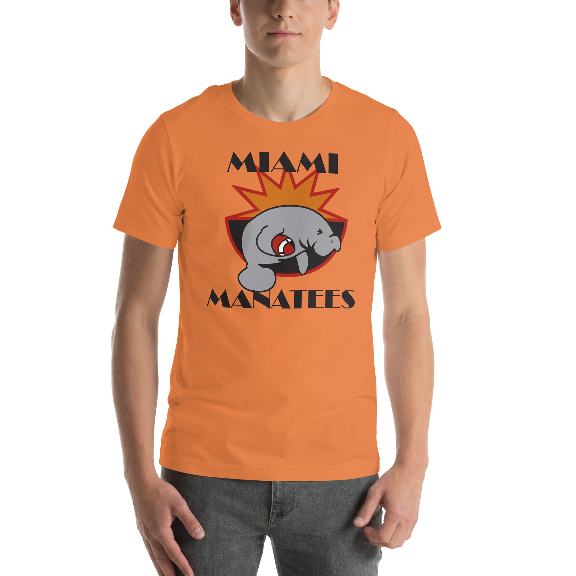 Miami Manatees T-Shirt burnt orange. Manatee holding football leaping on front of half sun with red trim and black bowl. Miami in Broadway Script black above Manatees in Brush Script black below. Royal Retros.