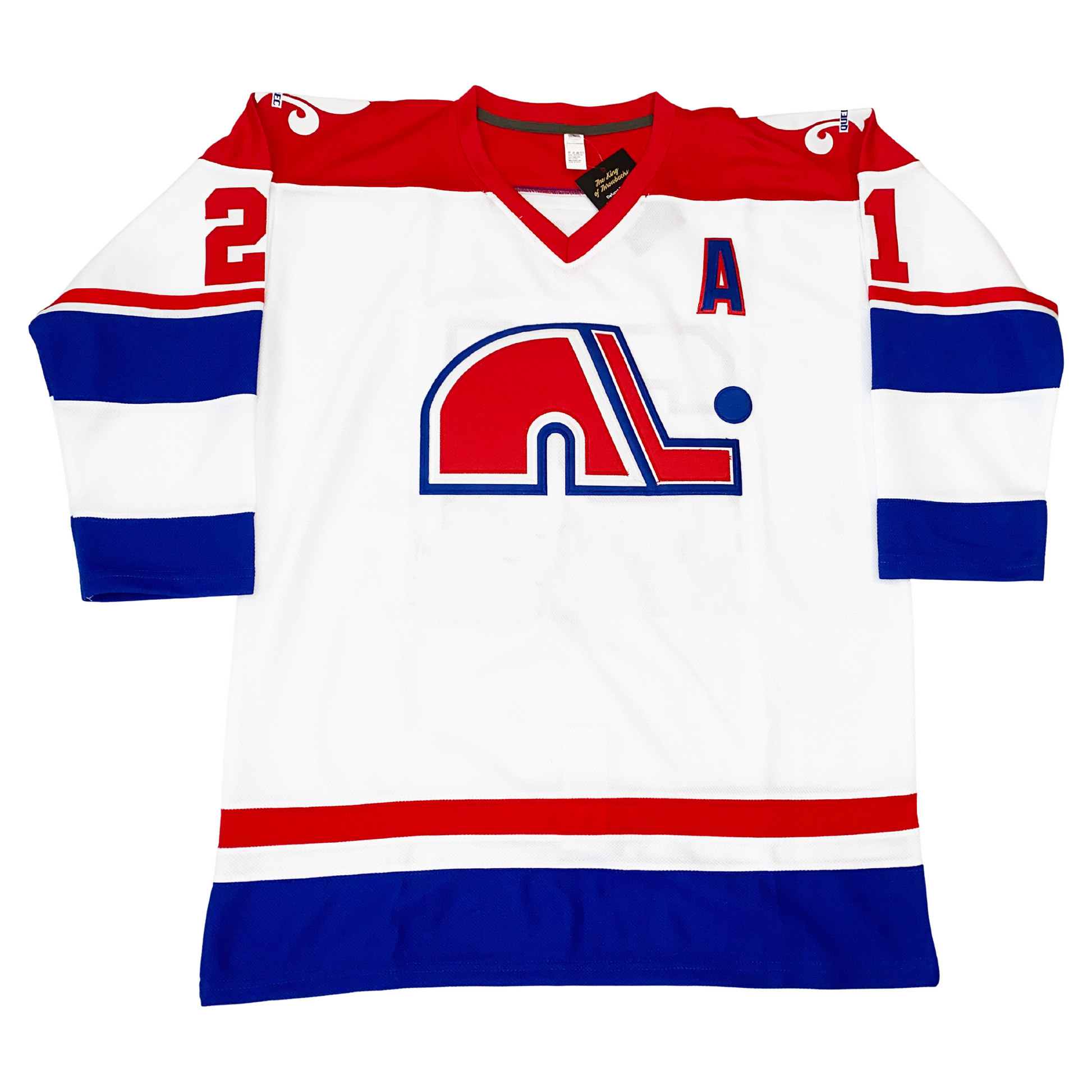 WHA Nordiques Jersey 1974 white. Red shoulders and collar. Thin red and white band above large blue, white and blue bands on sleeves. #21 in red on shoulders. Red, white, and larger blue band on waist. fleur-de-lis in white on shoulders.  Red N lowercase logo with white and blue trim. Red hockey stick to right of letter with blue and white trim, blue puck above blade. Alternate captain "A" on upper left chest. Royal Retros 