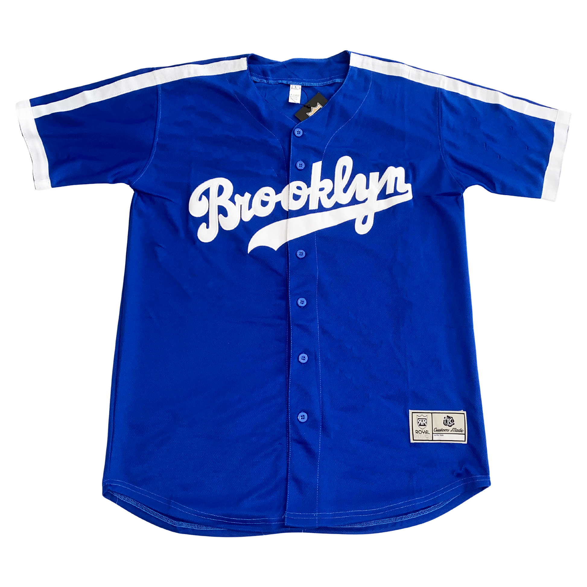 Brooklyn Dodgers blue button-up baseball jersey. White bands on shoulders and around sleeve ends. Brooklyn in cursive in white with text tail. Royal Retros