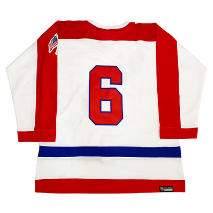 Brooklyn Americans jersey back. White. Red shoulders and half red sleeves. Blue band above waist, red at waist. Large #6 in red with blue trim on back. Royal Retros