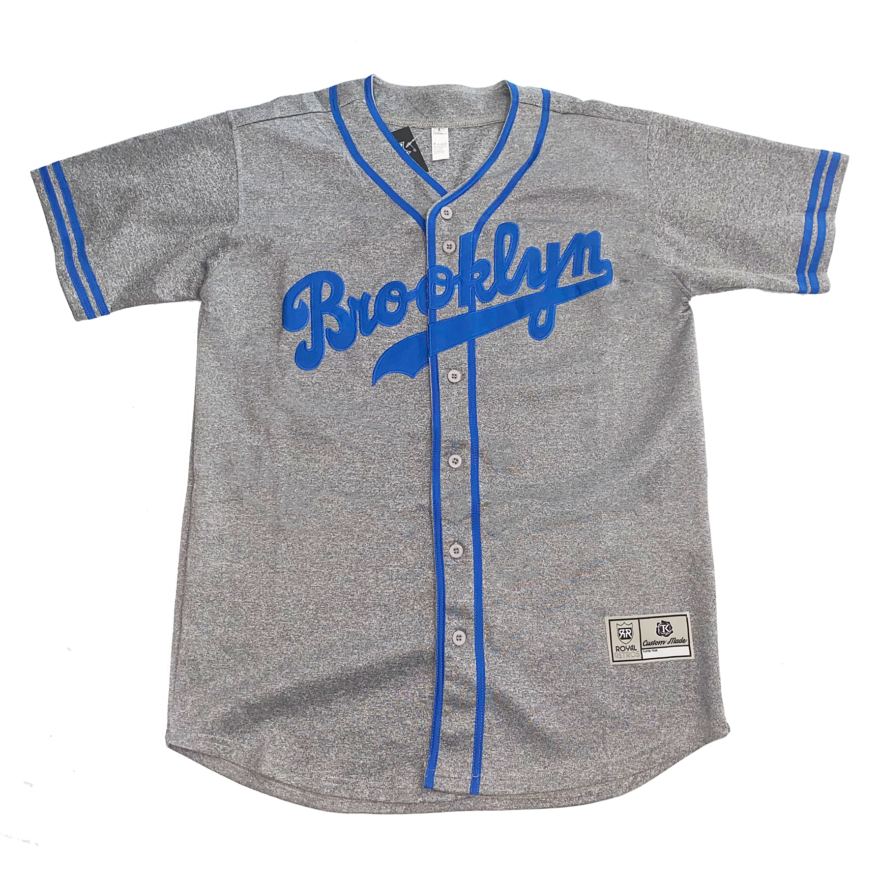 Brooklyn Dodgers button-up baseball jersey. Pepper gray. Two thins blue stripes at sleeve ends, around neck and down front on either side of buttons. Brooklyn in cursive in blue with a text tail. Royal Retros