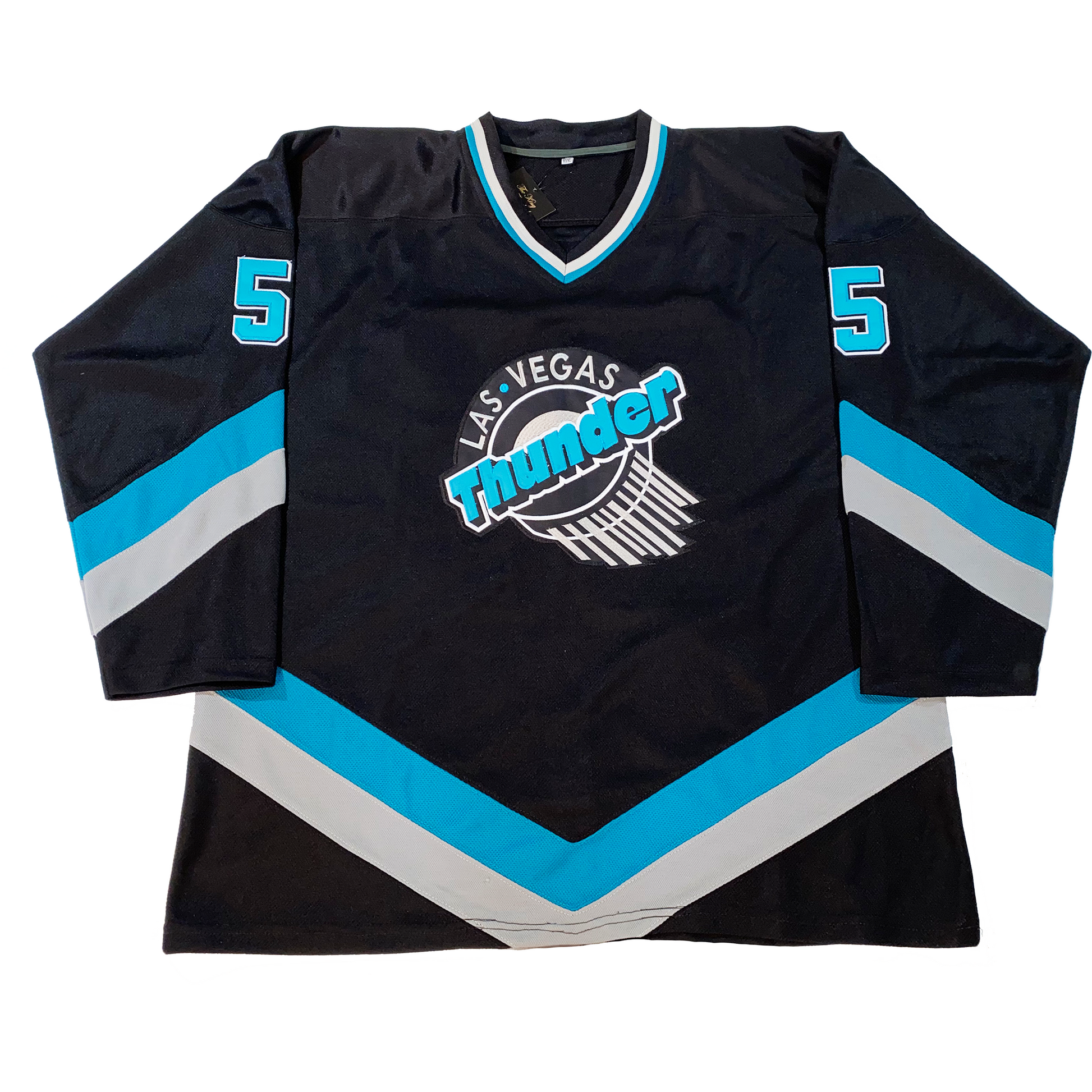 Las Vegas Thunder hockey jersey black. Teal and white diagonal bands on sleeves and waist. Logo on chest. Las Vegas in white over Thunder in teal diagonally over hockey puck with swish marks leading away from the bottom right down. Royal Retros