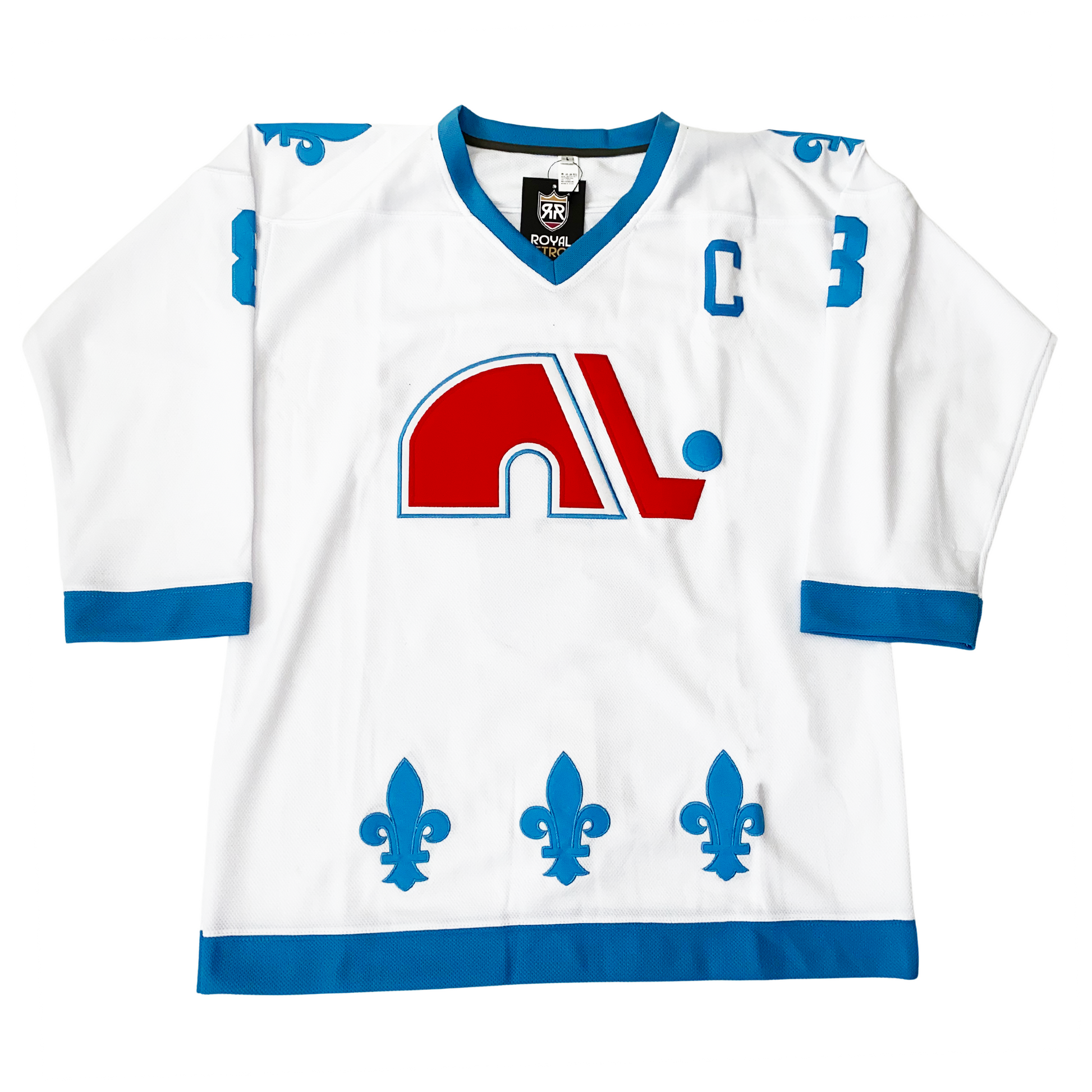 WHA Nordiques Jersey 1976 white. Blue fleur-de-lis on shoulders and around waist. Blue bands on sleeve ends and waist. Captain's C in blue on left chest.  Red lowercase N logo with blue trim. Red hockey stock down the  right side of N, blue puck above blade. Royal Retros