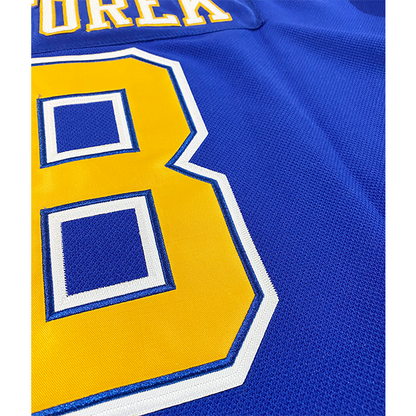 Phoenix Roadrunners Jersey close-up of number 8 gold with white outline. back Royal Retros